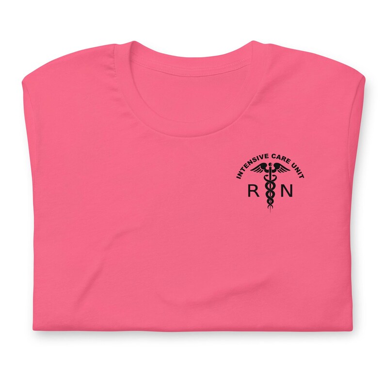 Folded bright pink ICU nurse shirt with black ICU RN left-chest graphic.