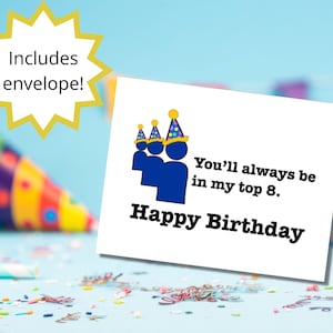 May include: A white card with a blue and yellow graphic of people wearing party hats. The text on the card reads "You'll always be in my top 8. Happy Birthday".