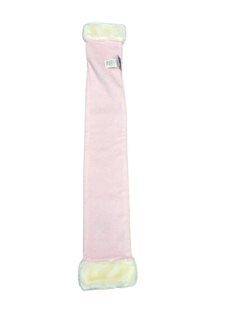 May include: A pale pink scarf with cream-coloured faux fur trim at each end. The scarf is long and rectangular, made from a soft material. A small tag is attached to the scarf.