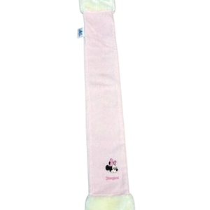 May include: A pale pink scarf with white faux fur edging. It has an embroidered Minnie Mouse motif and the word "Disneyland" in pink script.