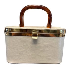 Bolso vintage de mediados de siglo, estilo caja blanca de los años 60 con asa de lucita de carey e interior forrado con cachemira.