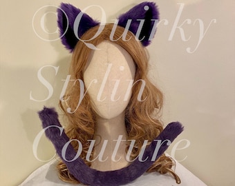 May include: Purple cat ears and tail headband. The ears are made of soft, fluffy fur and are attached to a headband. The tail is also made of soft, fluffy fur and is attached to a band that can be worn around the waist.