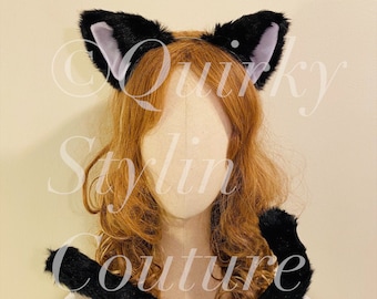 May include: Black cat ears headband and tail set. The headband has soft black fur ears with a light purple lining. The tail is long and fluffy.