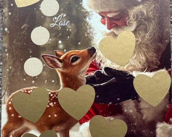 May include: A Christmas-themed card with a Santa Claus and a deer. The card has a gold background with gold hearts and white circles. The text "Weihnachtswunder" and "Lose" are visible on the card. The card also has a die with black dots and the text "30 + ?".