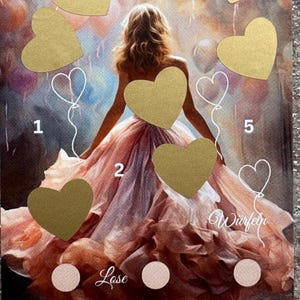 May include: A birthday game with a golden heart design. The game includes a board with hearts and numbers, a dice, and a lose option. The board features a woman in a pink dress with a golden heart on her chest.