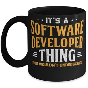 May include: Black coffee mug with a white design that says "It's a Software Developer Thing - (You Wouldn't Understand)".
