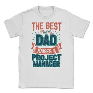 May include: White t-shirt with a vintage-style graphic that reads "The Best Kind of Dad Raises a Project Manager".