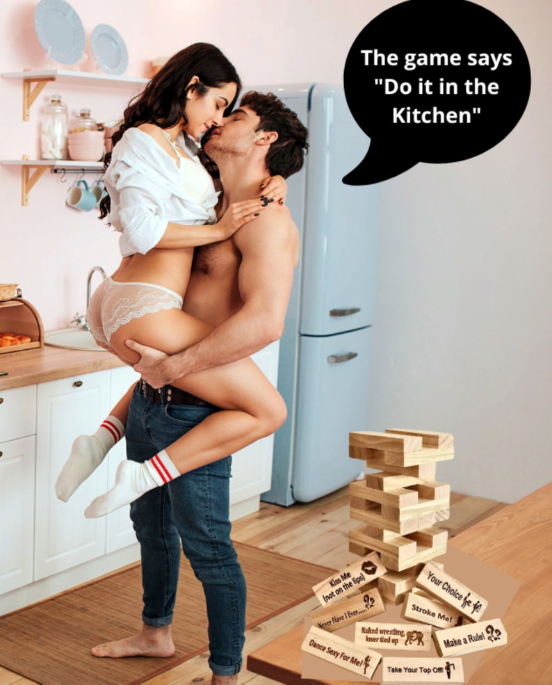 girl straddlingguy in kitchen in underwear with party blox game sitting on counter and caption saying that the game says do it in the kitchen player games for couples relationship gifts for boyfriend romantic card game couples edition lets fucking