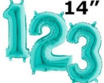 Può includere: Tre palloncini numerici in lamina blu turchese da 35,5 cm, che formano il numero 123.