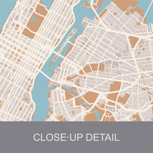 May include: A detailed map of a city with a large body of water running through it. The map is in shades of brown, blue, and white. The text "CLOSE-UP DETAIL" is at the bottom of the map.