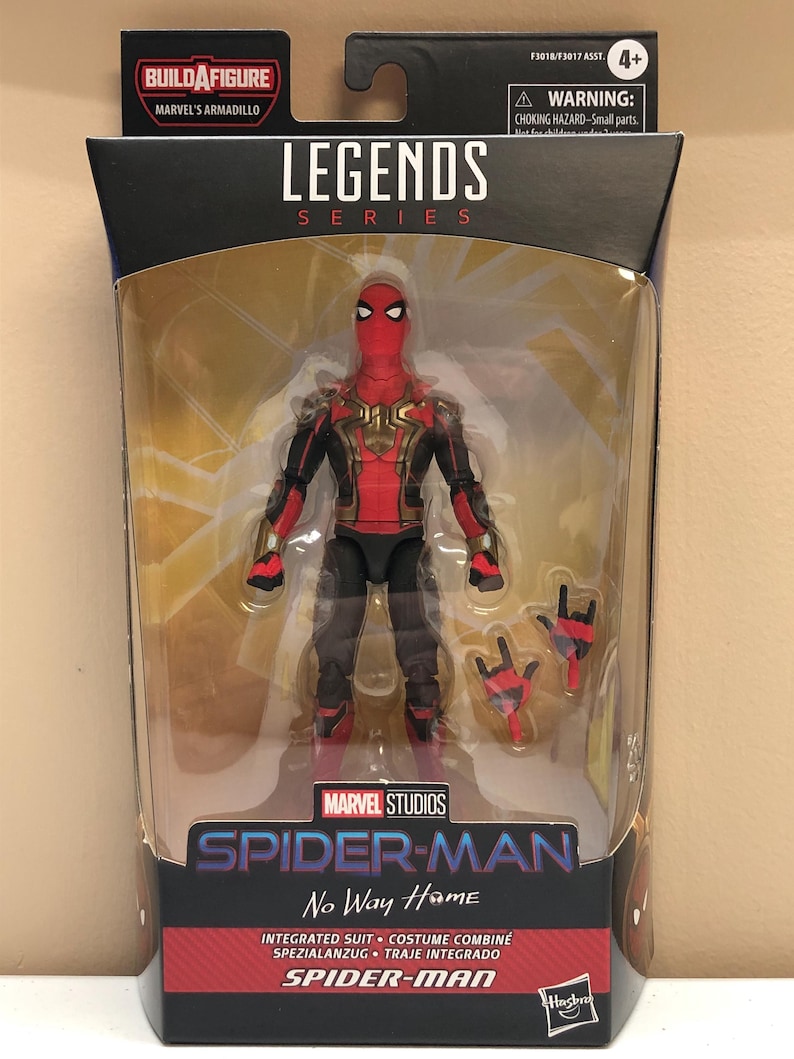 May include: Marvel Legends Series action figure of Spider-Man in his red and black suit with gold accents. The figure is holding a pair of web shooters. The packaging features the title "Spider-Man No Way Home" and the words "Integrated Suit - Costume Combin&eacute; - Spezialanzug - Traje Integrado - Spider-Man".