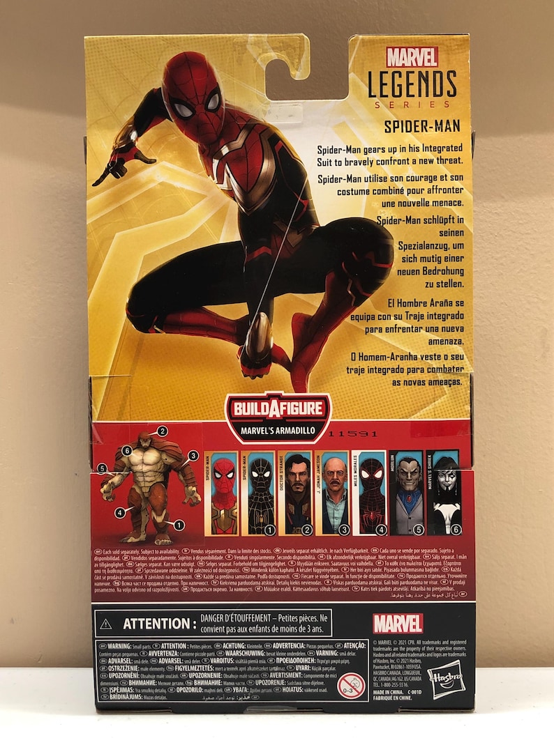 May include: A Marvel Legends Series Spider-Man action figure with a red and black suit. The figure is posed in a dynamic action pose. The packaging features a Build-A-Figure Marvel's Armadillo figure. The packaging also includes text in English, French, German, Spanish, and Portuguese.