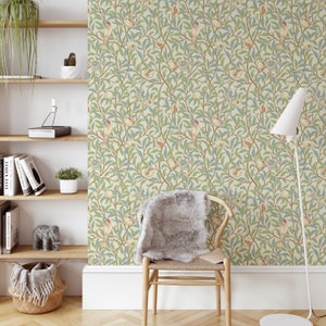 May include: A beige wallpaper with a repeating pattern of green leaves, red berries, and small birds. The wallpaper is shown in a room with a wooden chair and a lamp.