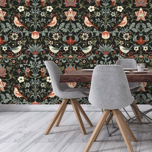 May include: A dining room with dark floral wallpaper featuring birds and plants. Four chairs with wooden legs and grey fabric seats surround a wooden table.