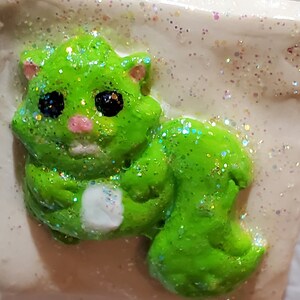 Refrigerator Magnet of A Green Phabrisaur Squirrel from Unphoundland