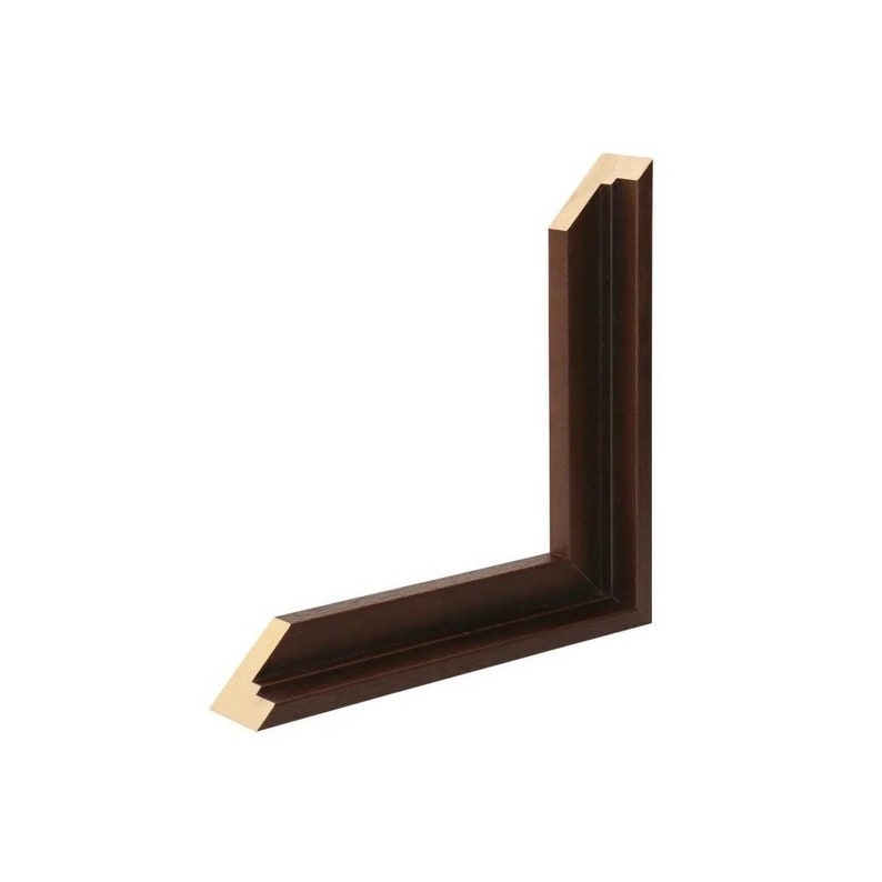 May include: A dark brown picture frame with a gold trim. The frame has a simple, classic design.