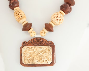 carved bone and bone necklace with bone and wooden pendant