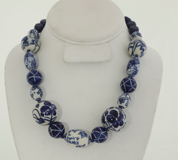 assorted shapes and sizes of blue and white Chinese porcelein beads