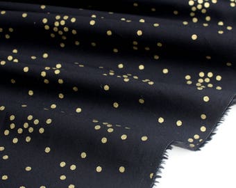 Poplin fabric cotton fluid golden peas black background x 50cm