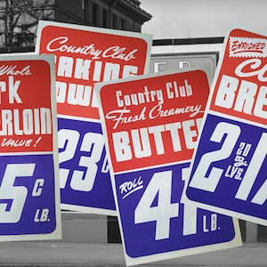 May include: Vintage grocery store signs with red and blue text. Signs advertise pork tenderloin at 45 cents per pound, butter at 41 cents per pound, and bread. The signs are in front of a black and white building.