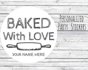 May include: White round sticker with the words "BAKED With LOVE" and a rolling pin illustration. The text "YOUR NAME HERE" is below the rolling pin. The words "PERSONALIZED PARTY STICKERS" are to the right.