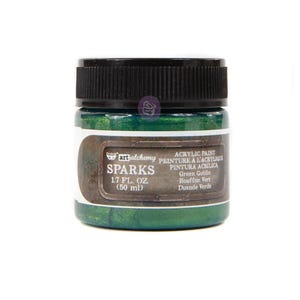 May include: A jar of Art Alchemy Sparks acrylic paint in Green Goblin. The jar has a black lid and a label with the product name, volume (1.7 fl oz), and other details. The paint has a shimmering, emerald green color.