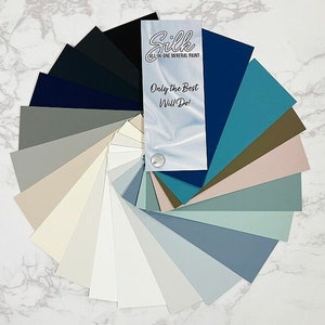 May include: A fan-shaped color chart with 20 paint samples in various shades of blue, gray, and white. The chart is labeled "Silk All-in-One Mineral Paint" and includes the text "Only the Best Will Do!"