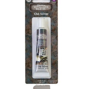 May include: A tube of art alchemy metallic wax in the color old silver. The tube is 0.68 fl oz (20 ml).