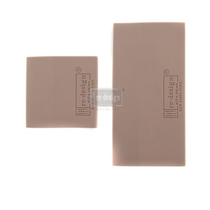 May include: Two rectangular blocks of brown foam with the text "re-design with Prima. DIY Simplified" printed on them.