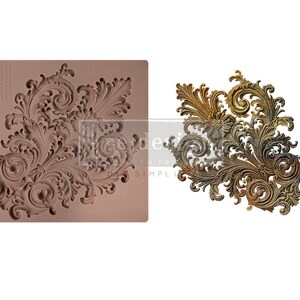 May include: A silicone mold for creating decorative cake or sugarcraft accents. The mold features a detailed, intricate design of swirling, ornate scrollwork.