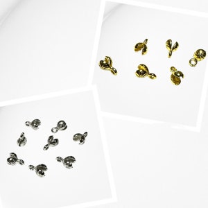 Peut inclure: Deux ensembles de embouts de sertissage en métal pour la fabrication de bijoux. Un ensemble est argenté et l'autre est doré.