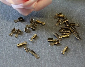 Approximately 200 crimp tips 7.5 x 2.5 mm in bronze-colored metal AP20