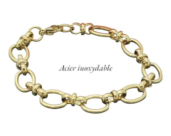 Un bracelet, connecteurs ovales, en acier inoxydable doré, AC587