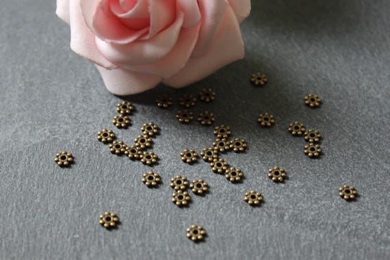 Petites perles métal bronze forme flocon de 4.5 mm, fournitures création bijoux, PMB04