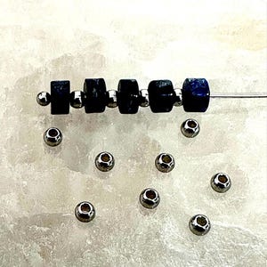 50 round beads in 202 stainless steel of 2.5 x 2 mm PMA133