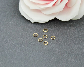50 anneaux ouverts, acier inoxydable doré, plaqué or 18k, 4 x 0.6 mm AP109