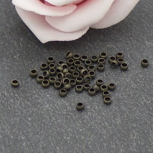 4 grs of 2.5 mm bronze metal crimp beads AP119