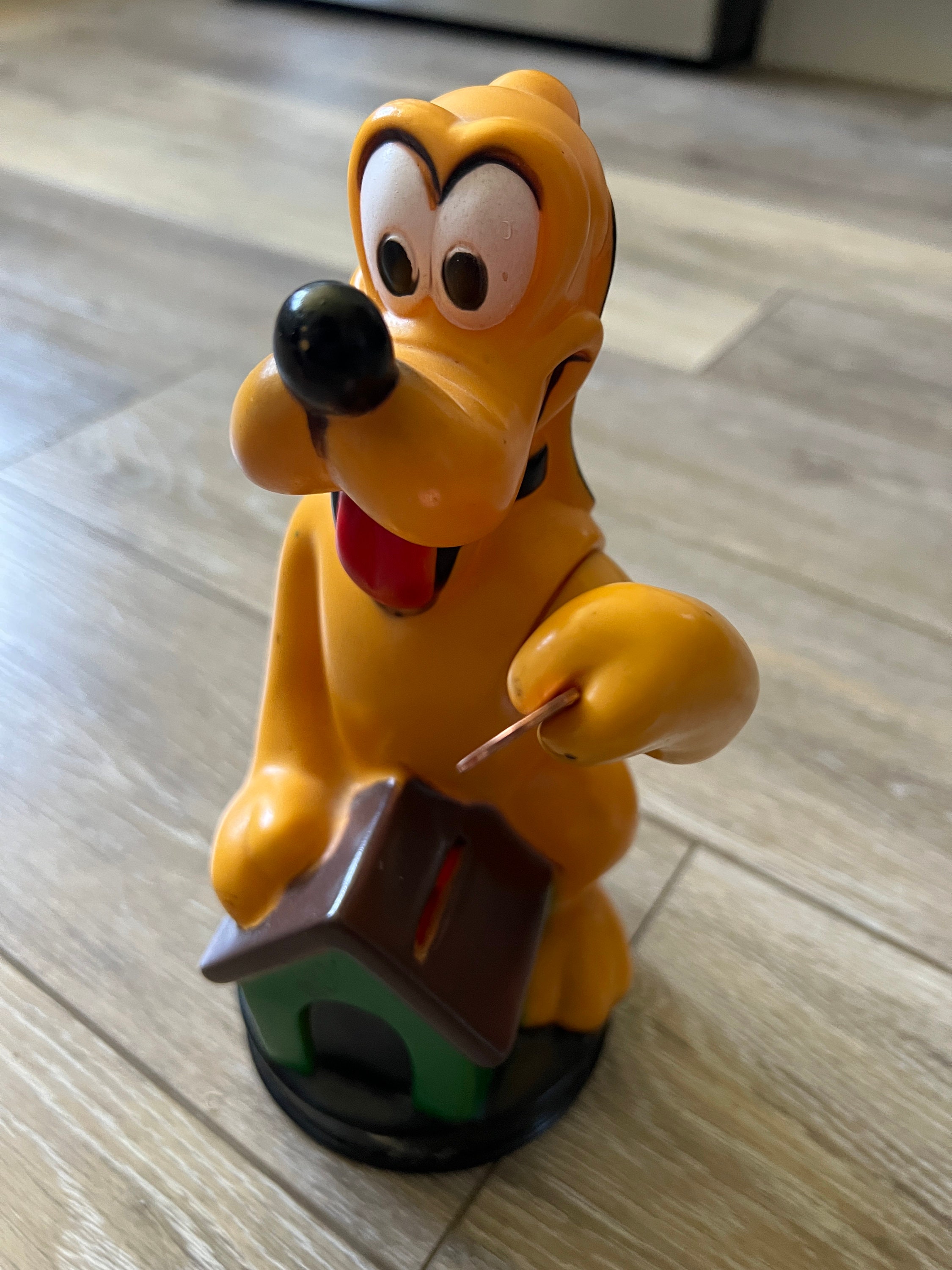 1980s Pluto PVC Coin Bank with moveable arm