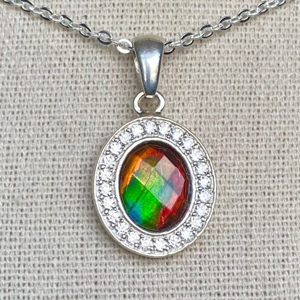Ammolite Pendant - Red, Green and Teal Faceted Gem in a Heavy Sterling Setting with a Halo of CZ Accents!  Please read Description