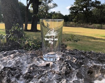 Custom 16 Oz. Fly Fishing Glass with white, vinyl 'You're So Fly' impression.