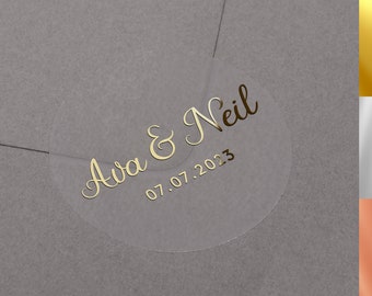 Foiled wedding envelope stickers with personalised names and date. Gold, Rose Gold or Silver foliage labels on semi clear label.