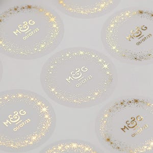 Celestial Wedding stickers. Gold Foiled personalised initials and date wedding labels. Semi clear matt envelope seals. Star stickers