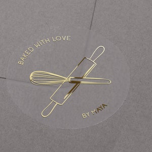 Baked with love stickers with personalised business name. Gold, rose gold, silver foiled custom bakery sticker. Semi clear matt custom label