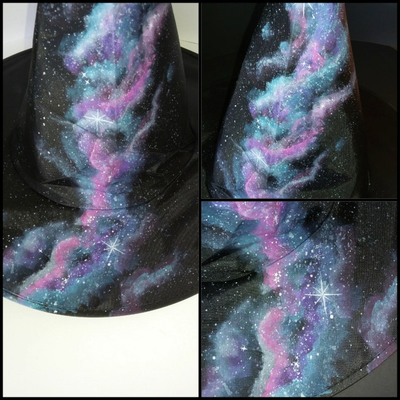 May include: A black witch's hat with a galaxy design painted on it. The design features blue, purple, and pink clouds with white stars.