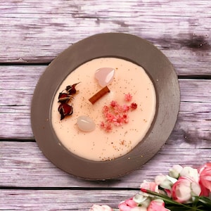 Self-love love candle in a concrete bowl with rose quartz, love oil, rose petals exclusively soy and beeswax. Wooden wick with extra portion of wax