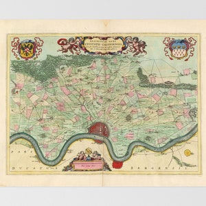 May include: An antique map of the city of Cologne, Germany, with a detailed depiction of the surrounding countryside. The map is printed in shades of green, pink, and blue, with a river winding through the center. The title "DESCRIPTIO AGRI CIVITATIS COLONIENIS" is printed at the top of the map.