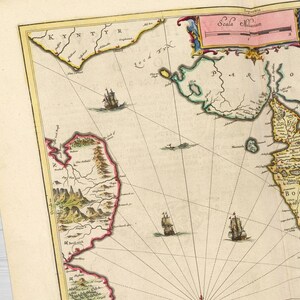 May include: An antique map of the coast of the Netherlands, with a compass rose in the center and a scale bar in the upper right corner. The map is printed on paper and has a yellowed, aged appearance. The map shows the coastline of the Netherlands, with various towns and cities labeled in Dutch. The map also shows the location of various islands and inlets.