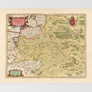 May include: A vintage map of Russia, featuring detailed geographical elements and text labels. The map is predominantly beige and green, with accents of red, pink, and blue. It includes decorative cartouches and a crest, showcasing historical cartography.