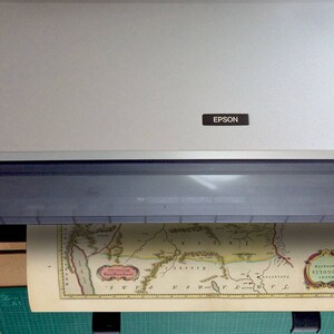 May include: A vintage map of the region of Visigothic Spain, titled "Waisneri Visigothorum Regnum", is being scanned on a flatbed scanner with an Epson label.