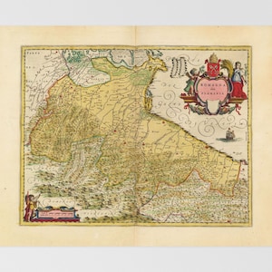 May include: An antique map of Romagna, an Italian region, with a coat of arms in the top right corner. The map is printed on aged paper with a yellowed hue and features a detailed depiction of the region's rivers and towns.